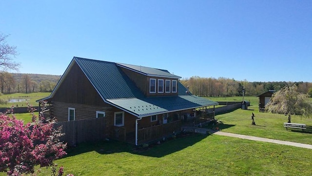 4138 Hubbs Rd, Hector, NY 14818 - view of home's exterior with a yard and metal roof