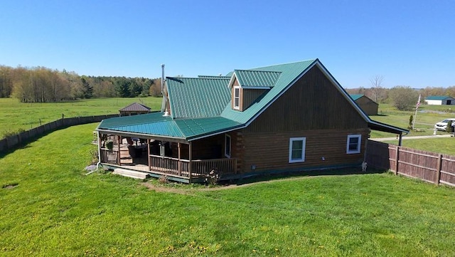 4138 Hubbs Rd, Hector, NY 14818 - back of house featuring metal roof, log siding, and a porch