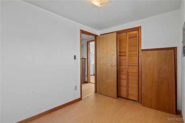 449 Madison Ave, Evans, NY 14006 - unfurnished bedroom featuring a closet and light flooring