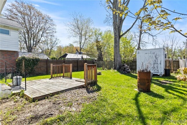 449 Madison Ave, Evans, NY 14006 - view of yard featuring a storage shed, an outbuilding, and a deck