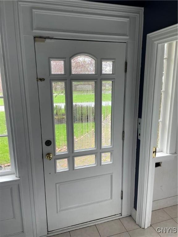 10 Sage Ct, Utica, NY 13502 - doorway to outside with light tile patterned floors and healthy amount of natural light