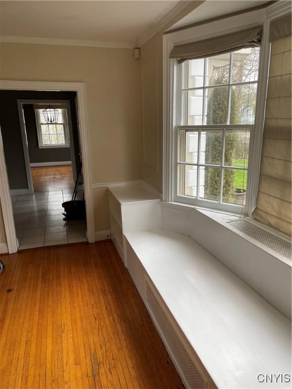 10 Sage Ct, Utica, NY 13502 - hall featuring crown molding, light wood-type flooring, and baseboards