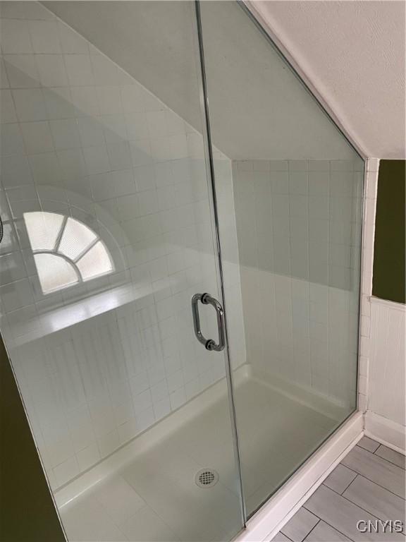 10 Sage Ct, Utica, NY 13502 - bathroom featuring a shower stall