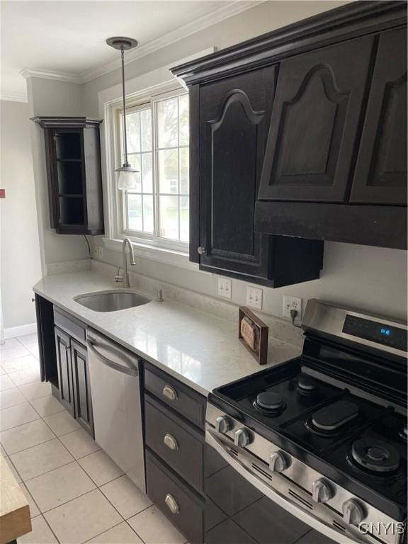 10 Sage Ct, Utica, NY 13502 - kitchen featuring stainless steel appliances, a sink, crown molding, light countertops, and light tile patterned floors