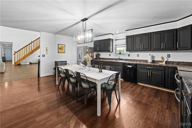 7678 Totman Rd, Cicero, NY 13212 - dining space with dark wood-style floors, stairs, baseboards, and a chandelier