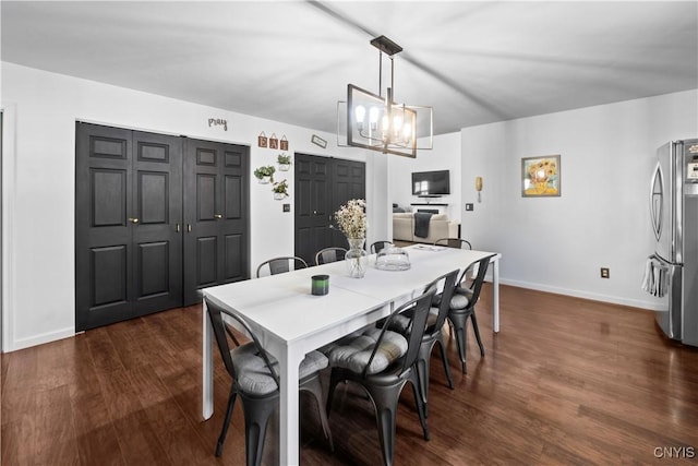 7678 Totman Rd, Cicero, NY 13212 - dining room with dark wood-type flooring, baseboards, and a chandelier