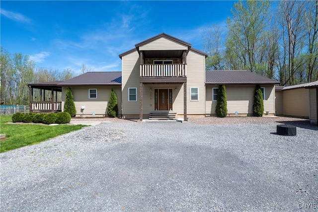 7678 Totman Rd, Cicero, NY 13212 - view of front of house featuring a balcony and metal roof