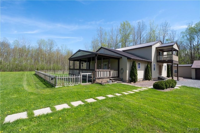 7678 Totman Rd, Cicero, NY 13212 - view of front of house with a porch, a front yard, metal roof, and a balcony