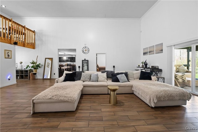 7678 Totman Rd, Cicero, NY 13212 - living room with a high ceiling, dark wood-style flooring, and ornamental molding