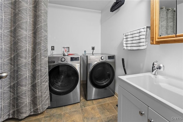 7678 Totman Rd, Cicero, NY 13212 - washroom featuring washing machine and clothes dryer, stone finish flooring, a sink, and baseboards