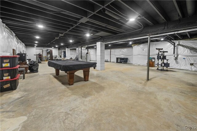 7678 Totman Rd, Cicero, NY 13212 - playroom featuring pool table, concrete floors, and gas water heater