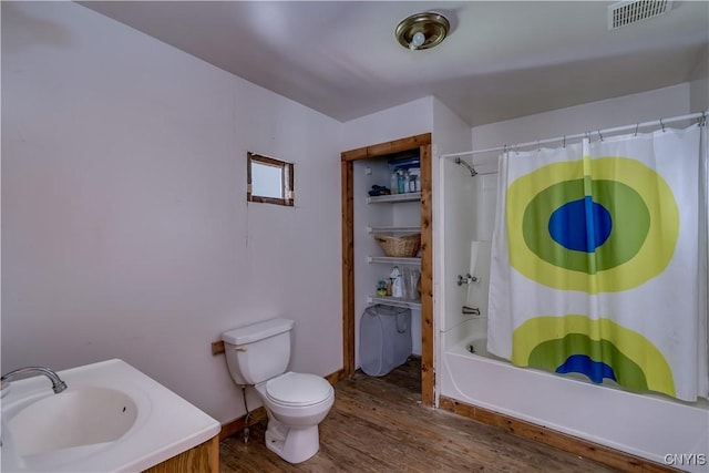 3323 County Route 95, Worth, NY 13659 - bathroom featuring wood finished floors, shower / tub combo, toilet, and vanity