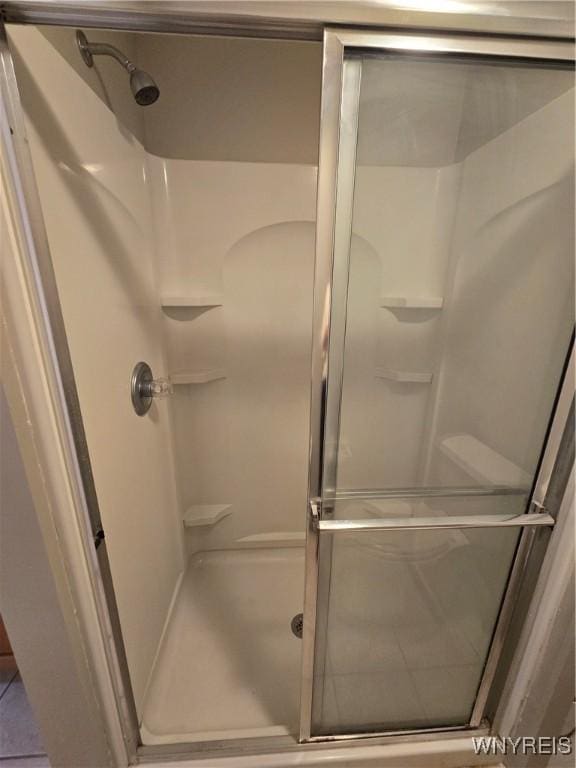 full bathroom featuring a shower stall