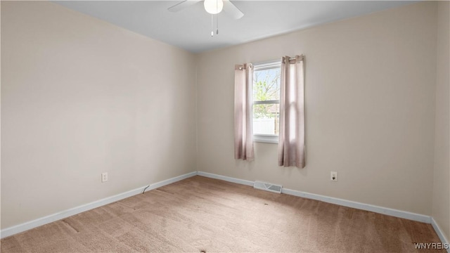 1350 Caravelle Dr, Niagara Falls, NY 14304 - spare room featuring a ceiling fan, carpet flooring, and baseboards