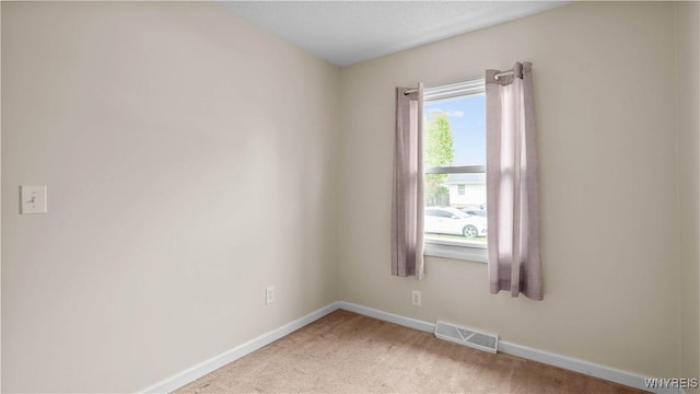 1350 Caravelle Dr, Niagara Falls, NY 14304 - spare room with baseboards and light colored carpet