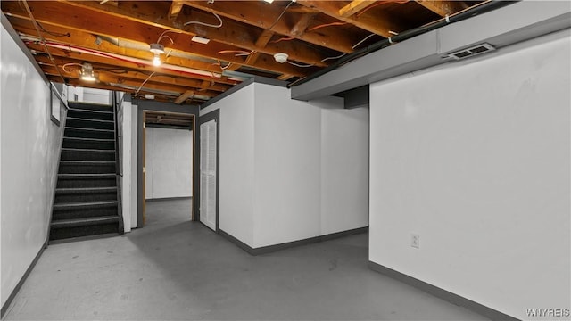 1350 Caravelle Dr, Niagara Falls, NY 14304 - below grade area with baseboards and stairs