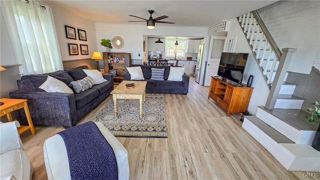 5416 W Lake Rd, Fleming, NY 13021 - living area with ceiling fan, light wood-style flooring, and stairs