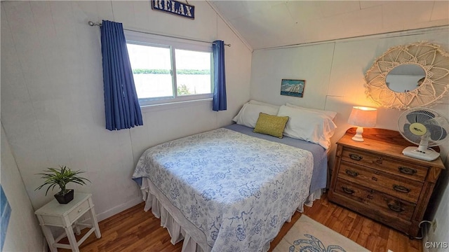 5416 W Lake Rd, Fleming, NY 13021 - bedroom with lofted ceiling and wood finished floors