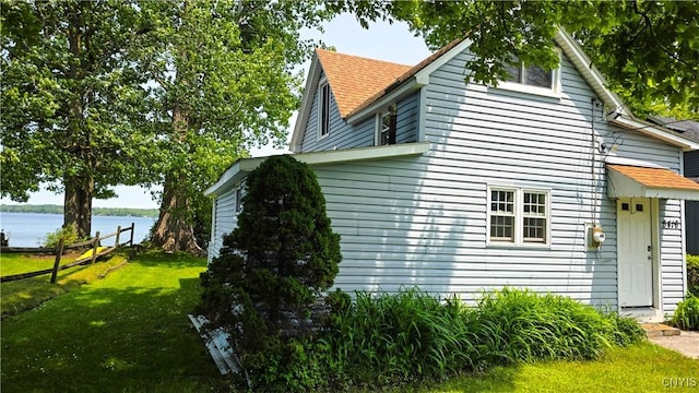 5416 W Lake Rd, Fleming, NY 13021 - view of side of home with a water view and roof with shingles