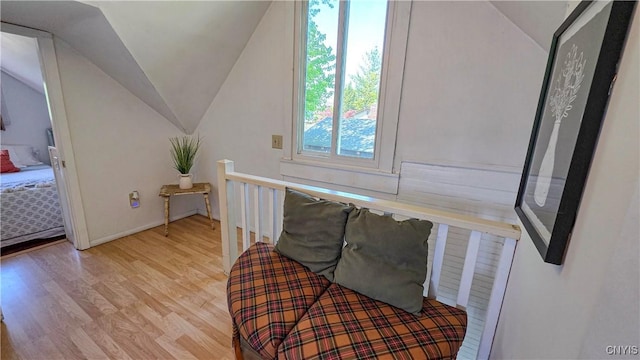 5416 W Lake Rd, Fleming, NY 13021 - stairway featuring vaulted ceiling, wood finished floors, and baseboards