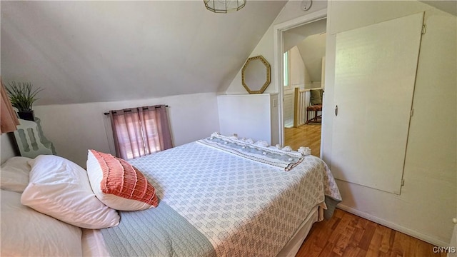 5416 W Lake Rd, Fleming, NY 13021 - bedroom with wood finished floors, lofted ceiling, and baseboards