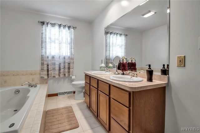 761 Pletcher Rd, Lewiston, NY 14092 - bathroom featuring a garden tub, tile patterned flooring, double vanity, and toilet