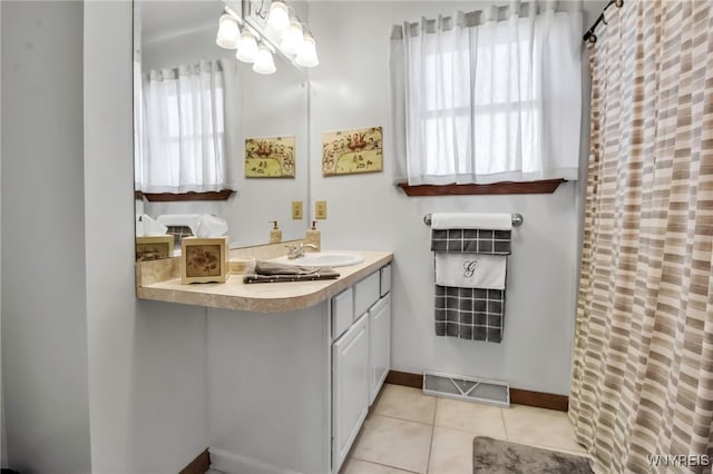 761 Pletcher Rd, Lewiston, NY 14092 - bathroom featuring tile patterned flooring, vanity, and baseboards