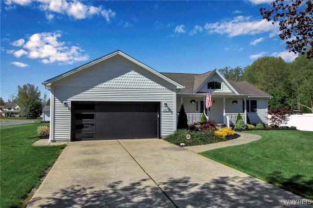 761 Pletcher Rd, Lewiston, NY 14092 - view of front of home with covered porch, a front lawn, a garage, and driveway