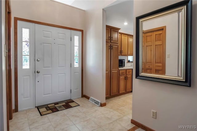761 Pletcher Rd, Lewiston, NY 14092 - entrance foyer featuring baseboards, plenty of natural light, and light tile patterned flooring