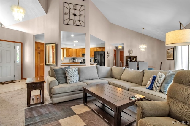 761 Pletcher Rd, Lewiston, NY 14092 - living area with a chandelier, high vaulted ceiling, and light colored carpet