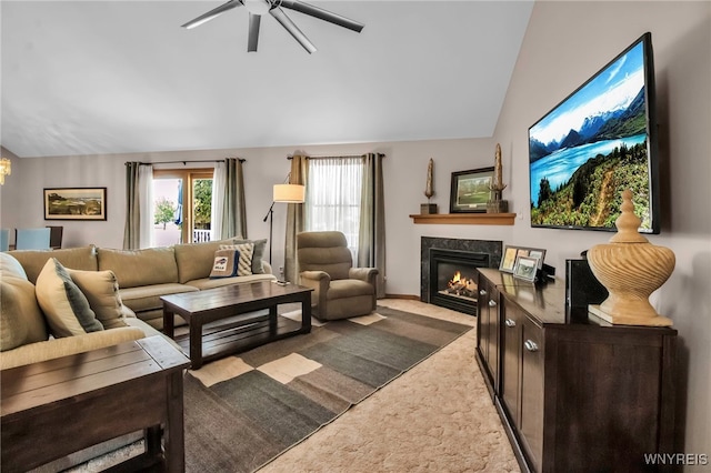 761 Pletcher Rd, Lewiston, NY 14092 - living area featuring lofted ceiling, a premium fireplace, carpet, and a ceiling fan