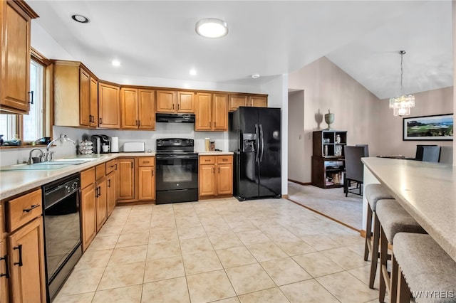 761 Pletcher Rd, Lewiston, NY 14092 - kitchen featuring black appliances, under cabinet range hood, a sink, light countertops, and a chandelier