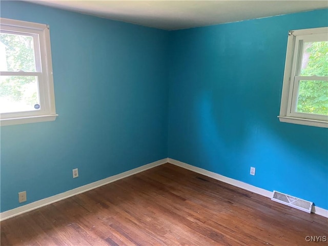 138 W Lynhurst Ave, Syracuse, NY 13205 - spare room with dark wood finished floors and baseboards