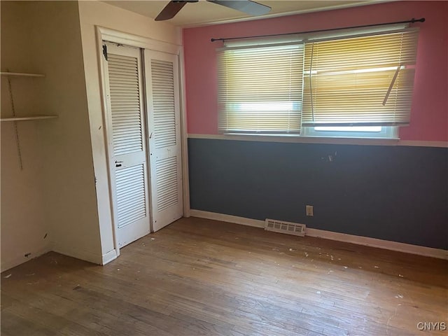 138 W Lynhurst Ave, Syracuse, NY 13205 - unfurnished bedroom featuring hardwood / wood-style flooring, a closet, and a ceiling fan