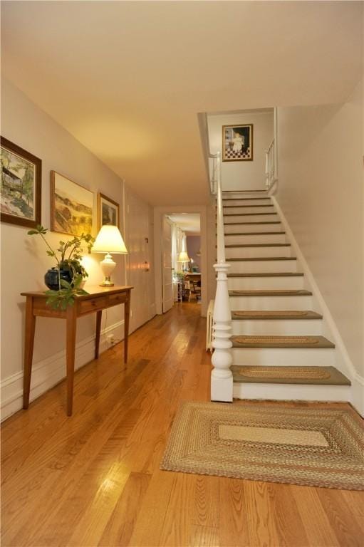 77 Hendy Creek Rd, Big Flats, NY 14905 - stairway featuring wood finished floors