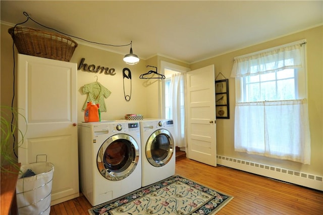 77 Hendy Creek Rd, Big Flats, NY 14905 - washroom with washer and dryer, a baseboard radiator, and wood finished floors