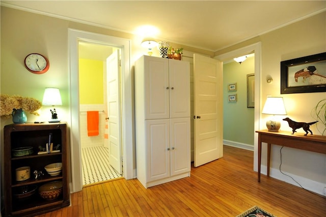 77 Hendy Creek Rd, Big Flats, NY 14905 - living area featuring light wood finished floors, crown molding, and baseboards