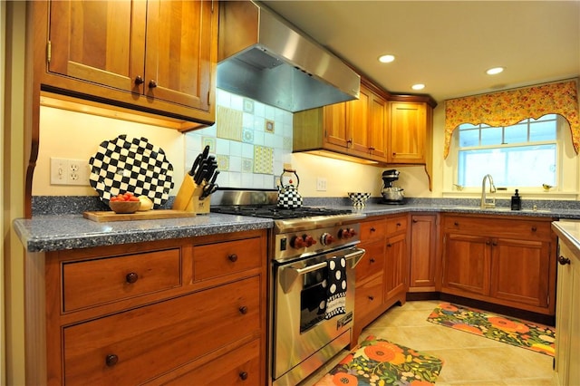 77 Hendy Creek Rd, Big Flats, NY 14905 - kitchen with high end stove, wall chimney range hood, brown cabinets, a sink, and recessed lighting