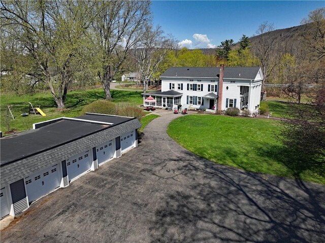 77 Hendy Creek Rd, Big Flats, NY 14905 - rear view of property featuring a yard and a chimney