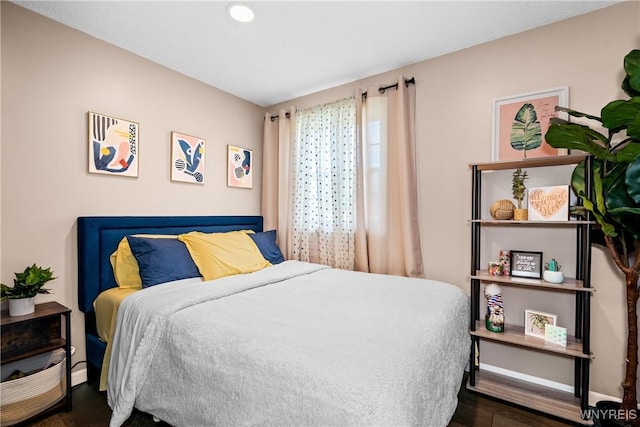 bedroom featuring recessed lighting and wood finished floors