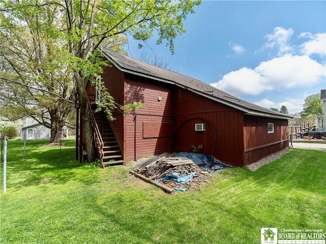 10412 Main St, Mina, NY 14736 - view of side of property with a lawn, stairs, and an outbuilding