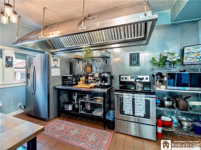 10412 Main St, Mina, NY 14736 - kitchen featuring appliances with stainless steel finishes, tile patterned flooring, and extractor fan