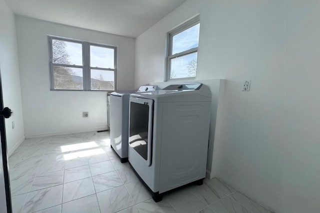 5 Bronk St, Oneonta-City, NY 13820 - washroom with washer and dryer, light marble finish floors, plenty of natural light, and baseboards