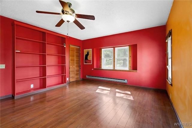 unfurnished room featuring a baseboard radiator, wood finished floors, a textured ceiling, ceiling fan, and baseboards