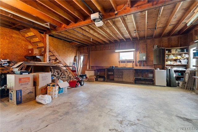 garage featuring a workshop area and a garage door opener