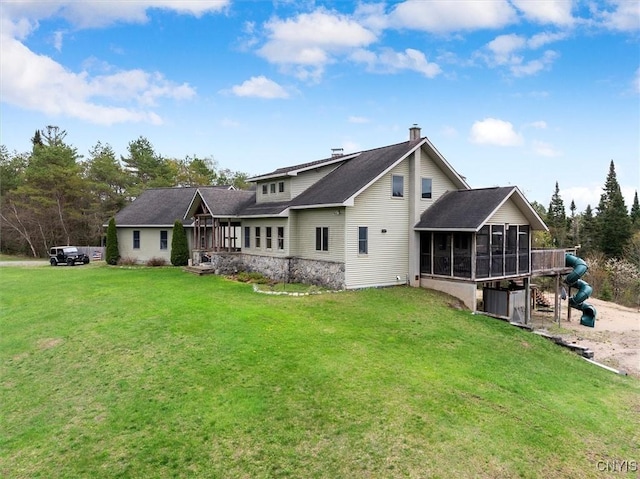 463 Hughes Rd, Russia, NY 13438 - back of property featuring a sunroom, a chimney, and a lawn