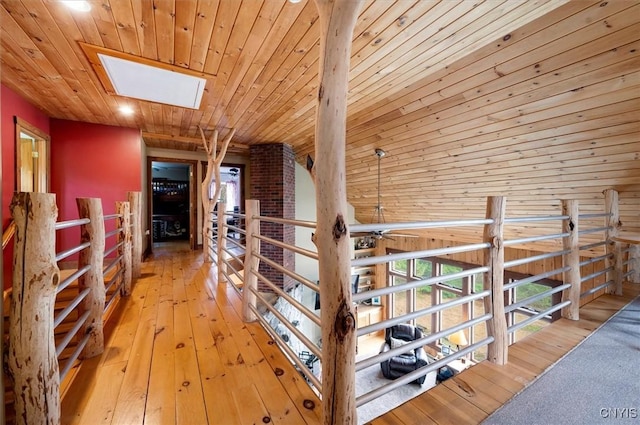 463 Hughes Rd, Russia, NY 13438 - hall with wood ceiling, a skylight, wood-type flooring, and an upstairs landing