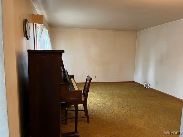 carpeted office space with baseboards