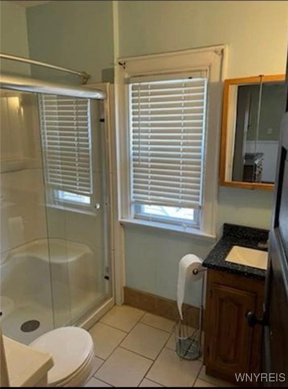 11 Indian Church Rd Unit S, Buffalo, NY 14210 - full bathroom featuring vanity, a shower stall, tile patterned floors, and toilet