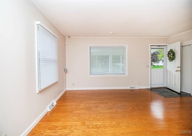 6 Tyler Ct, Manlius, NY 13104 - spare room with wood finished floors, ornamental molding, and baseboards